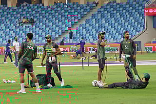 Pakistan team memebrs warm up beore their  Asia Cup match against UAE at Dubai International stadium on Wednesday. 