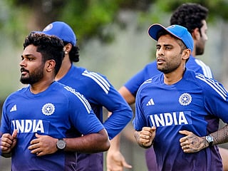 Sanju Samson (left) and Suryakumar Yadav (right) attend a practice session at the ICC Academy in Dubai on September 16, 2025, ahead of their Asia Cup 2025 T20 match against Oman. 