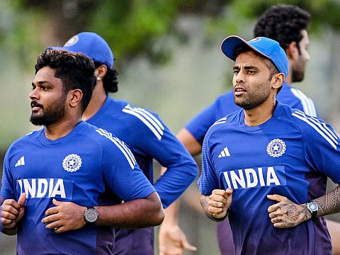 Sanju Samson (left) and Suryakumar Yadav (right) attend a practice session at the ICC Academy in Dubai on September 16, 2025, ahead of their Asia Cup 2025 T20 match against Oman. 