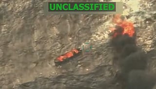 This screen grab from a video posted by US President Donald Trump on his Truth Social account on September 15, 2025, shows what Trump says is US Military forces conducting a strike on a boat carrying alleged drug traffickers in the Caribbean Sea in the SOUTHCOM area of responsibility on Monday, September 15, 2025.