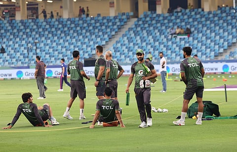 Pakistan team memebrs warm up beore their  Asia Cup match against UAE at Dubai International stadium on Wednesday. 