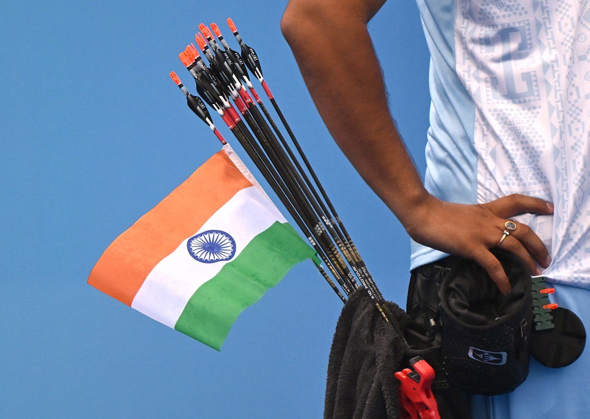 An Indian national flag is seen on an arrow of India's Abhishek Verma as he competes against India's Ojas Pravin Deotale in the archery compound men's individual gold medal match during the 2022 Asian Games in Hangzhou in China's eastern Zhejiang province on October 7, 2023.