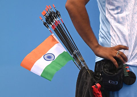 An Indian national flag is seen on an arrow of India's Abhishek Verma as he competes against India's Ojas Pravin Deotale in the archery compound men's individual gold medal match during the 2022 Asian Games in Hangzhou in China's eastern Zhejiang province on October 7, 2023.