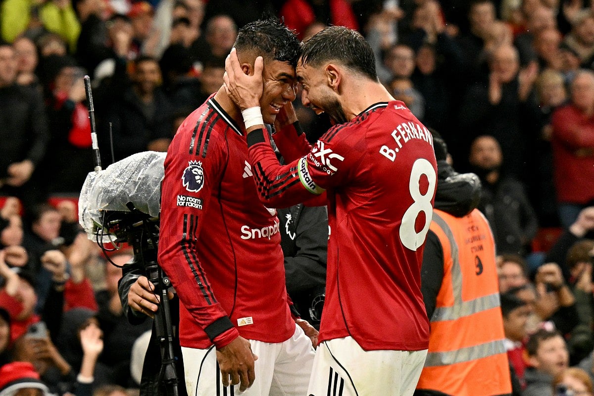 Manchester United's Brazilian midfielder Casemiro celebrates scoring the team's second goal during the English Premier League football match against Chelsea at Old Trafford in Manchester, north west England, on September 20, 2025.
