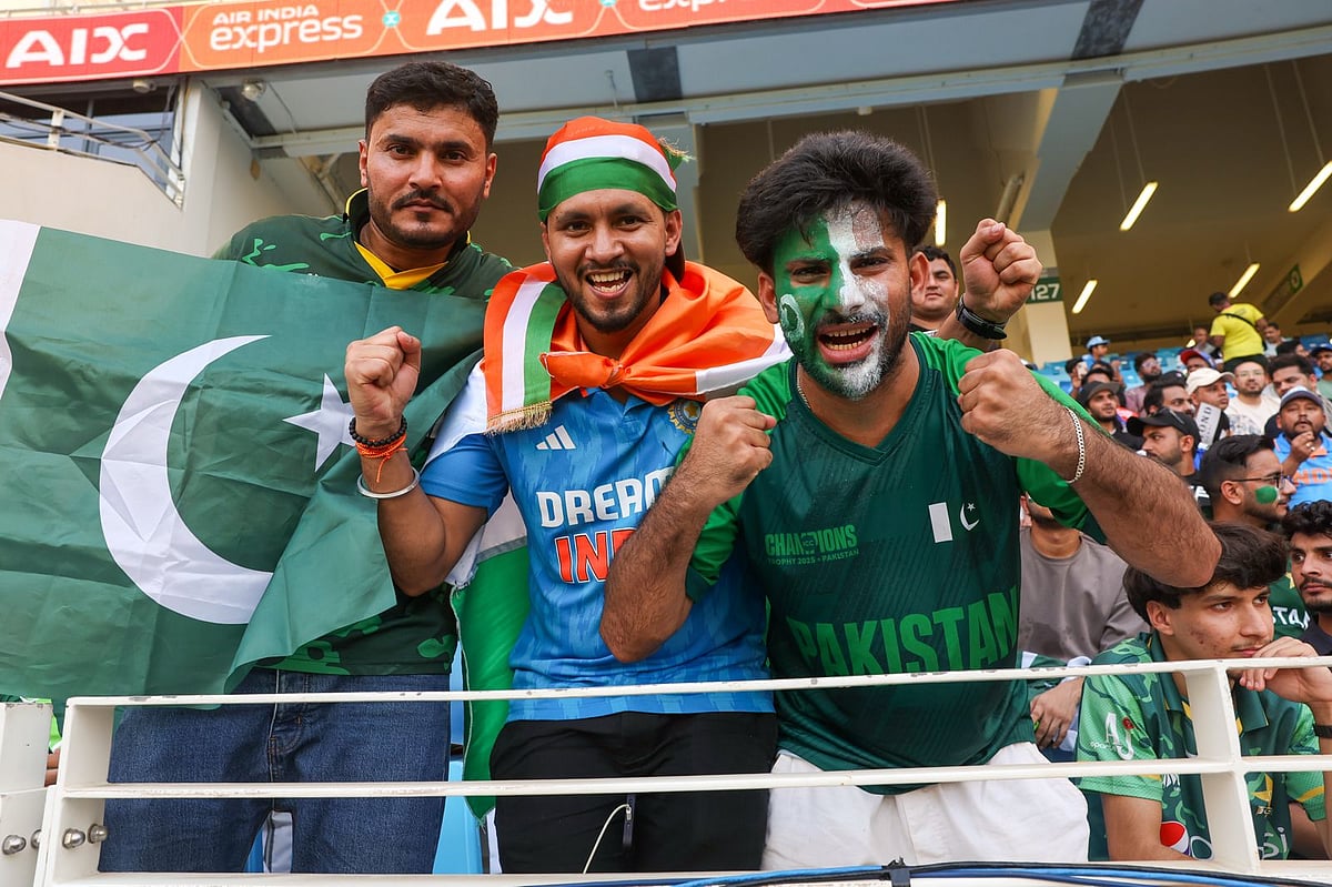 Fans cheer at the India vs Pakistan match at Dubai International Stadium.