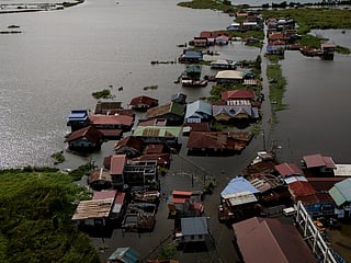 A drone view shows homes inundated by high tide and flooding in Calumpit, Bulacan, Philippines