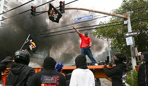 Protesters in Manila set fire to a truck used as a road barricade en route to the Presidential Palace. Some protesters brandished the same flag used by protesters Nepal. Local media reported a class between anti-corruption groups and the pro-Duterte camp. 