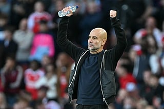 Manchester City's Spanish manager Pep Guardiola gestures on the touchline during the English Premier League football match against Arsenal at the Emirates Stadium in London on September 21, 2025.