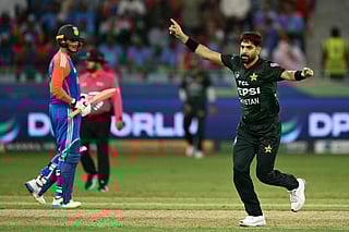 Pakistan's Haris Rauf (R) celebrates after taking the wicket of India's captain Suryakumar Yadav during the Asia Cup 2025 Super Four Twenty20 international cricket match between India and Pakistan at the Dubai International Stadium in Dubai on September 21, 2025.