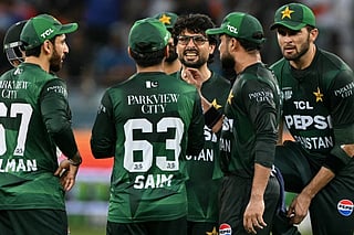 Pakistan's Abrar Ahmed (C) celebrates with teammates after taking the wicket of India's Abhishek Sharma during the Asia Cup 2025 