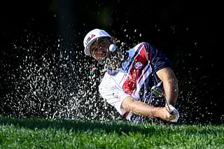 Scottie Scheffler of Team United States plays a shot from a bunker on the second hole during a practice round prior to the Ryder Cup 2025 at Black Course at Bethpage State Park Golf Course on September 22, 2025 in Farmingdale, New York.