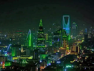 The Riyadh skyline glows in green and white as Saudi Arabia marks its 95th National Day.