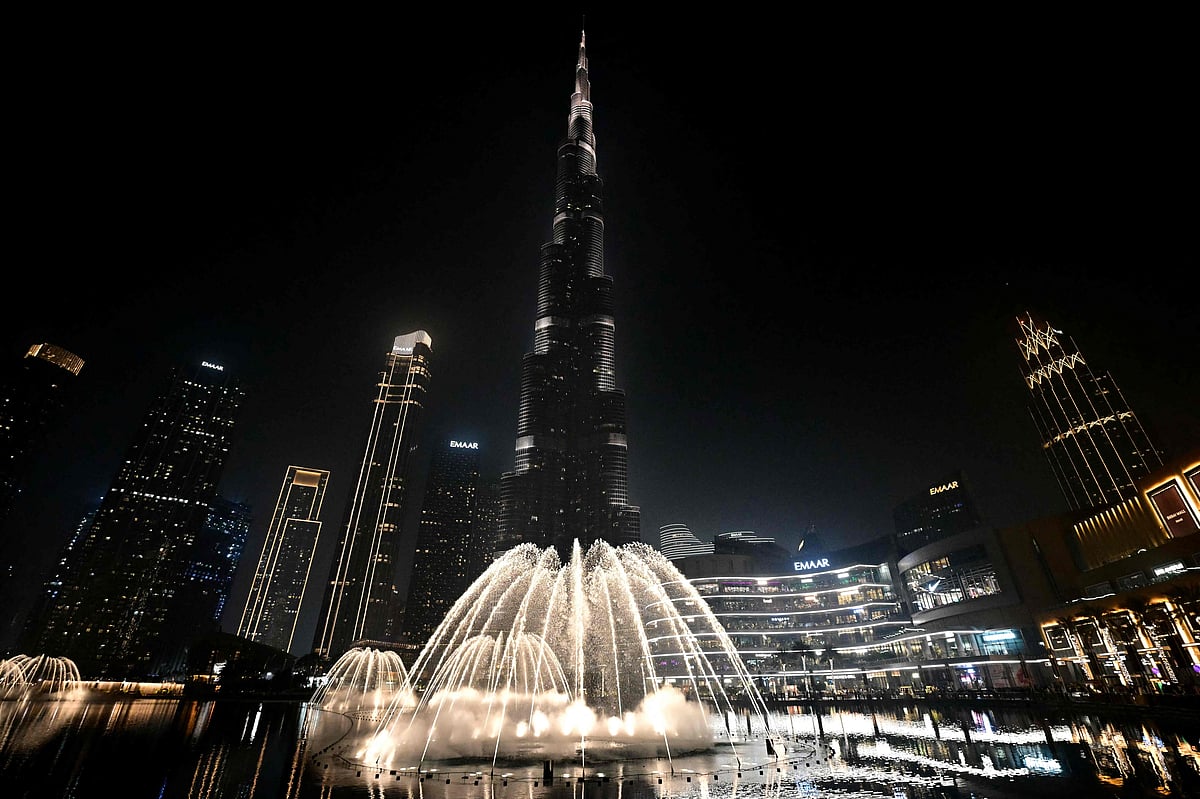 Fountains spray water during final testing beneath Burj Khalifa, the worlds tallest building, in Dubai on September 23, 2025.
