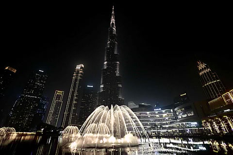 Fountains spray water during final testing beneath Burj Khalifa, the worlds tallest building, in Dubai on September 23, 2025.
