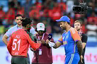 India's captain Suryakumar Yadav (R) and his Bangladesh's counterpart Jaker Ali (L) bump their fists during the toss before the start of the Asia Cup 2025 Super Four Twenty20 international cricket match between Bangladesh and India at the Dubai International Stadium in Dubai on September 24, 2025.