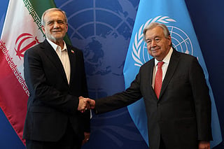 Iranian President Masoud Pezeshkian (L) shakes hands with the United Nations (UN) Secretary General Antonio Guterres during the UN's General Assembly on September 25, 2025, in New York City.