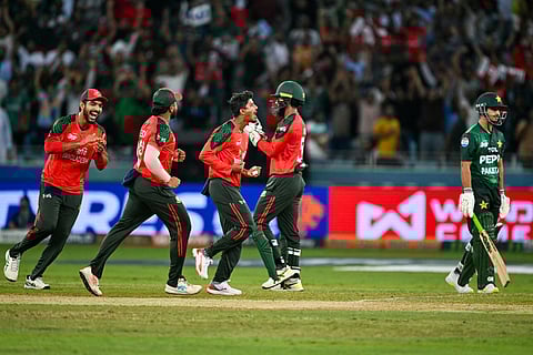 Bangladesh's Mahedi Hasan (C) celebrates after dismissing Pakistan's Saim Ayub during the Asia Cup 2025 Super Four Twenty20 international cricket match at the Dubai International Stadium in Dubai on September 25, 2025.