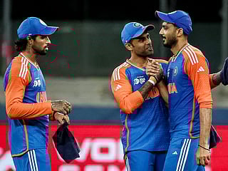 India's captain Suryakumar Yadav (C) celebrates with teammates after their win at the end of the Asia Cup 2025 Super Four T20 match against Bangladesh at the Dubai International Stadium on September 24, 2025. 