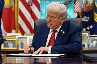 President Donald Trump signs a presidential memorandum on the death penalty in the District of Columbia in the Oval Office at the White House, Thursday, Sept. 25, 2025, in Washington.