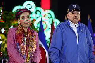 This handout picture released by the official El 19 Digital news outlet on September 25, 2025, shows Nicaragua's President Daniel Ortega and Co-President Rosario Murillo attending the parade marking the 46th anniversary of the Nicaraguan National Police in Managua.