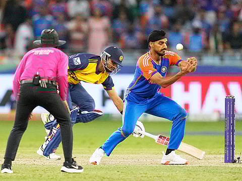 India's Arshdeep Singh tries unsuccessfully to run Sri Lanka's Dasun Shanaka out during the Asia Cup T20I at Dubai International Cricket Stadium, on Friday, September 26, 2025. 