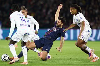 Paris Saint-Germain's Portuguese forward Goncalo Ramos (C) vies for the ball during the French L1 football match against Auxerre at the Parc des Princes stadium in Paris on September 27, 2025.