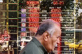An electronic board displays currency exchange rates in Ferdowsi Square in the Iranian capital Tehran on September 28, 2025,.