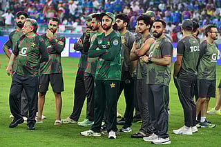 Pakistan's cricket team members wait for the presentation ceremony at the end of the Asia Cup 2025 Twenty20 international cricket final match between India and Pakistan at the Dubai International Stadium in Dubai on September 28, 2025.