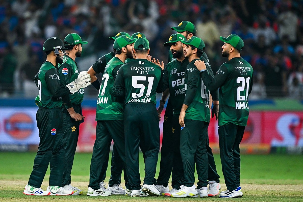 Pakistani players celebrate after dismissing India's Sanju Samson during the Asia Cup 2025 Twenty20 international cricket final match between India and Pakistan at the Dubai International Stadium in Dubai on September 28, 2025.