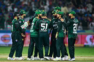 Pakistani players celebrate after dismissing India's Sanju Samson during the Asia Cup 2025 Twenty20 international cricket final match between India and Pakistan at the Dubai International Stadium in Dubai on September 28, 2025.