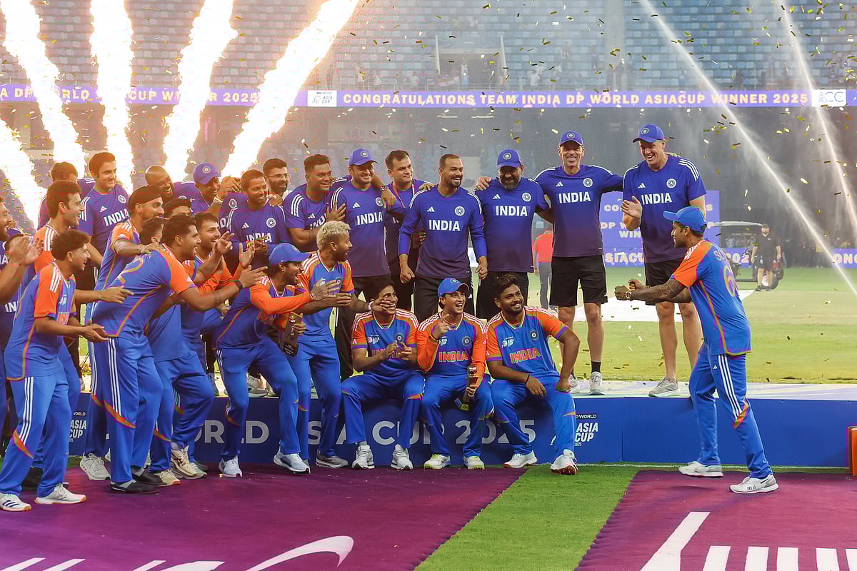 Indian captain Surya Kumar Yadav and team celebrate with an imaginary trophy after their win in the DP World Asia Cup final defeating Pakistan at Dubai International stadium on Sunday.