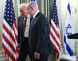 Trump (left) and Netanyahu leave at the end of a joint news conference in the State Dining Room at the White House on September 29, 2025 in Washington, DC.  