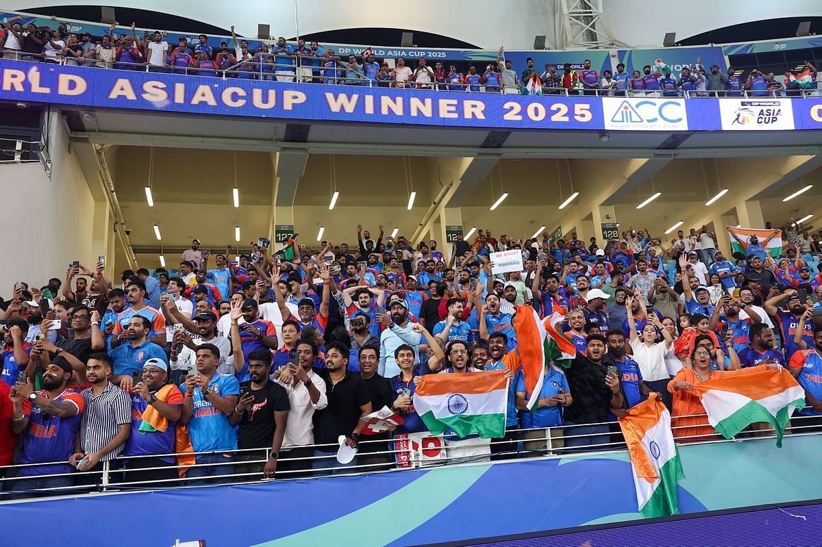 Indian fans celebrate their win in the DP World Asia Cup final defeating Pakistan at Dubai International stadium on Sunday.