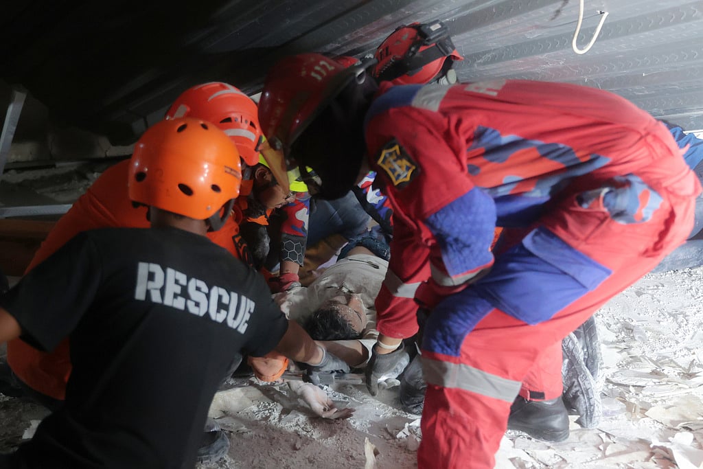 Searchers in Indonesia raced Tuesday to rescue dozens of people still believed trapped.