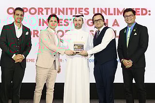 Abdulla Al Abdouli being presented with a memento by CA Jai Prakash Agarwal (to his left) and Ankur Aggarwal at the Investment Summit in Dubai. 