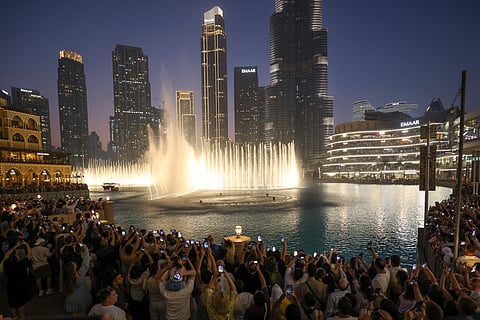 Huge crowd gathered to was Dubai fountain re opening in front of Burj Khalifa.  