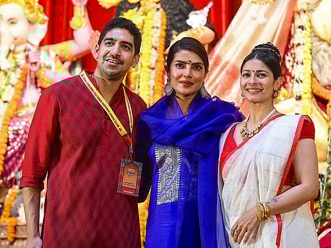 Mumbai’s festive season turned star-studded as Bollywood’s most prominent names gathered at the North Bombay Sarbojanin Durga Puja pandal, hosted by Rani Mukerji and Kajol’s family. Adding a special sparkle to the celebration this year was Priyanka Chopra, who is currently in Mumbai for an event. Above, Priyanka Chopra Jonas joins Tanishaa Mukerji and director Ayan Mukerji at Durga Puja celebrations in Mumbai.