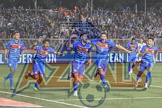 Team Philippines celebrate their win during the 2024 ASEAN Electric Cup semi-final round football match between the Philippines and Thailand at the Rizal Memorial Coliseum in Manila on December 27, 202