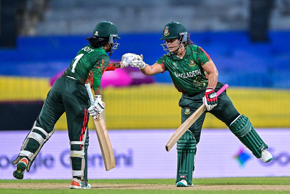 Bangladesh's Rubya Haider (R) and Nigar Sultana bump their fists during the ICC Women's Cricket World Cup 2025 One-Day International match at the R. Premadasa International Cricket Stadium in Colombo on October 2, 2025.