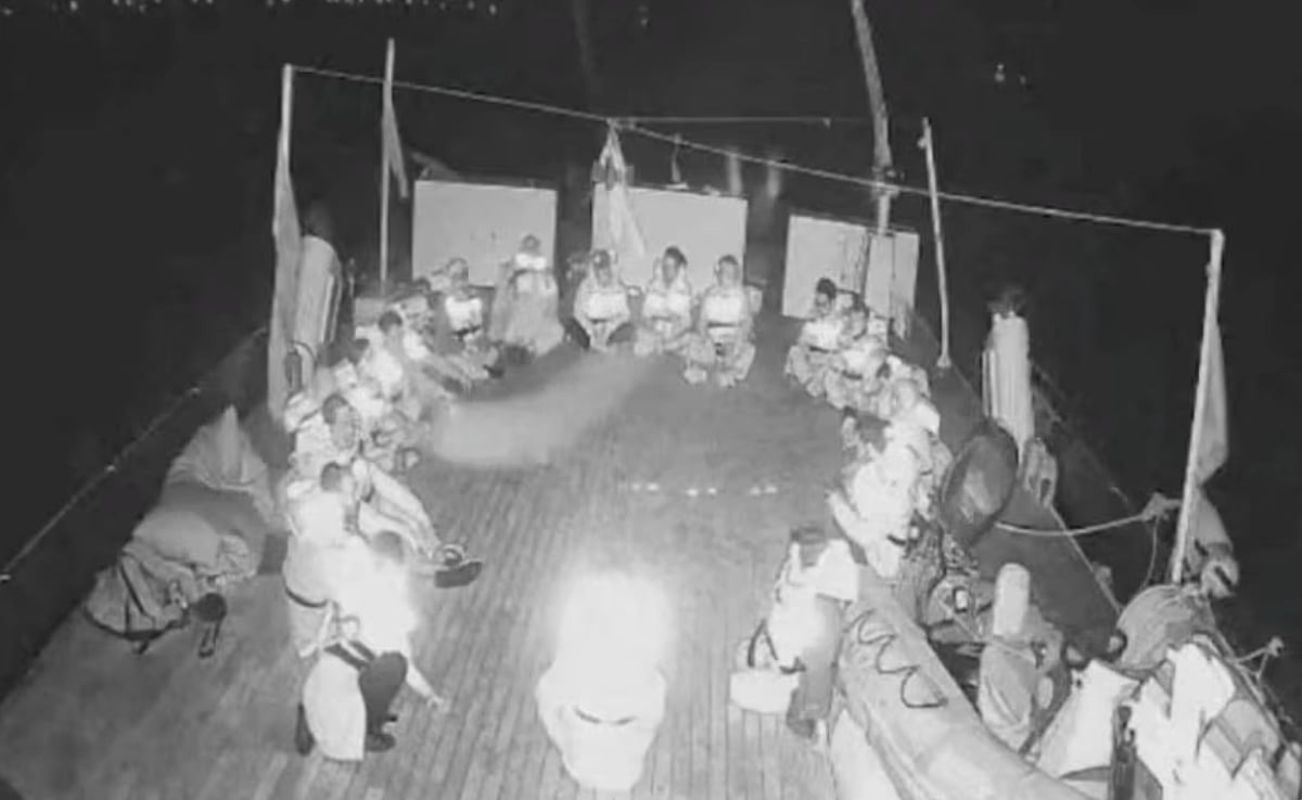 In this handout screenshot taken from live video footage, crew members can be seen sitting in a circle aboard the Gaza-bound "Alma" vessel on Wednesday. 
