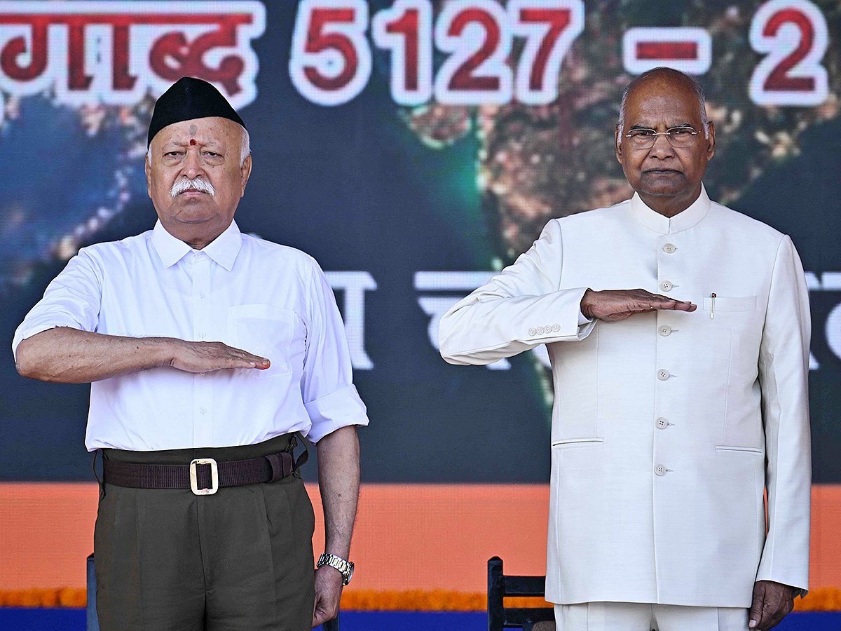 Rashtriya Swayamsevak Sangh (RSS) chief Mohan Bhagwat (L) and India's former President Ram Nath Kovind attend the centenary celebrations of the Hindu nationalist organisation at Reshimbagh Ground in Nagpur on October 2, 2025. 