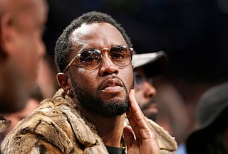 FILE - Sean "Diddy" Combs sits courtside in the second half of an NBA basketball game between the Brooklyn Nets and the New York Knicks, March 12, 2017, in New York. (AP Photo/Kathy Willens, File)