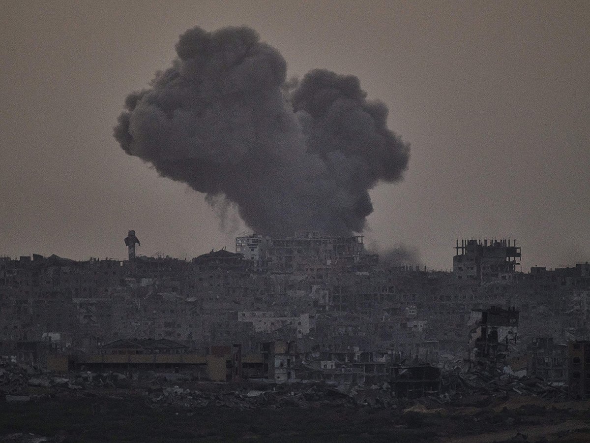 Smoke rises amid buildings, that were destroyed during the Israeli ground and air operations, following an Israeli military strike in the northern Gaza Strip, as seen from southern Israel, Friday, October 3, 2025. 