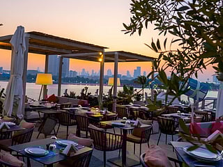 Perfect for lunch with fab daytime views, or  you can stick around for sunset magic that turns the sky golden at Ibn AlBahr at the Creek 