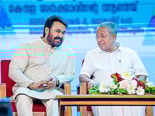 Mohanlal (left) with Kerala CM Pinarayi Vijayan on stage during the the state government’s public felicitation for the actor at the Central Stadium in Thiruvananthapuram on Saturday.