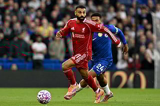 Liverpool's Egyptian striker Mohamed Salah runs with the ball during the English Premier League football match against Chelsea.