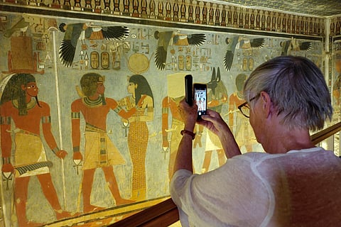 A tourist visits the tomb of King Amenhotep III in the Valley of the Kings near the city of Luxor.
