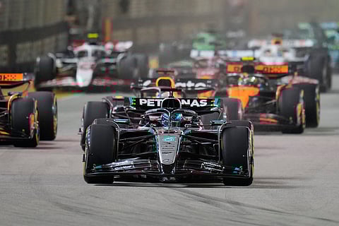 Mercedes driver George Russell of Britain leads the field after the start during the Singapore Formula One Grand Prix at the Marina Bay Street Circuit in Singapore, Sunday, October 5.