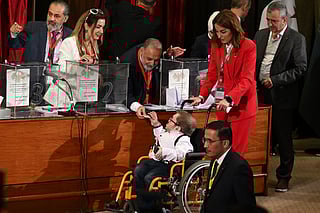 A member of Syria's local committees casts his vote in the country's selection process to designate an interim parliament, in Damascus on October 5, 2025.