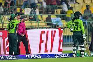 Pakistan's captain Fatima Sana (left) speaks with umpire after the dismissal of Pakistan's Muneeba Ali (R) during the ICC Women's Cricket World Cup 2025 one-day international (ODI) match against India at the R. Premadasa International Cricket Stadium in Colombo on October 5, 2025.
